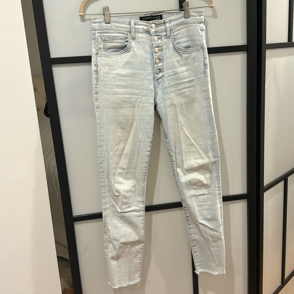 High-rise skinny jeans featuring a light-wash denim finish